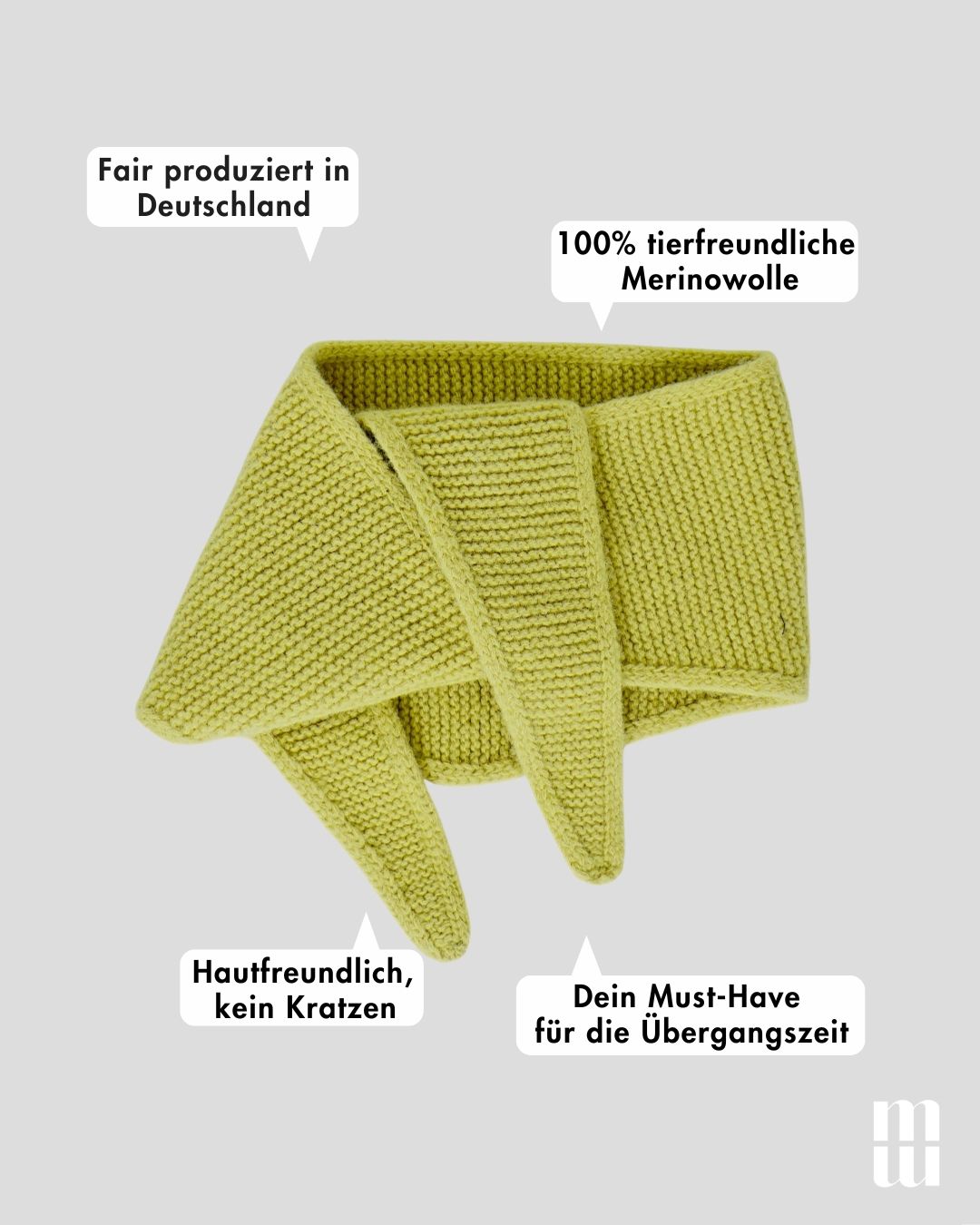 frontansicht von einem minischal aus merinowolle in gruen inklusive produktvorteilen